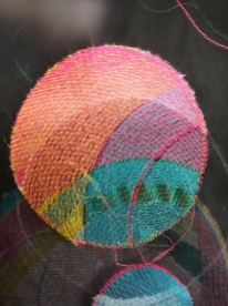 Close up. Digital Embroidery on black cotton organdi